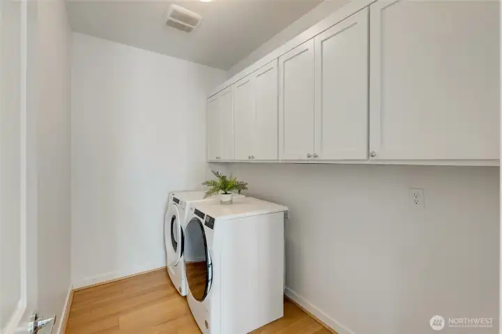 Dedicated laundry room with GE washer and dryer