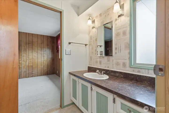 Continental style bathroom between bedroom and Mudroom-entry combo