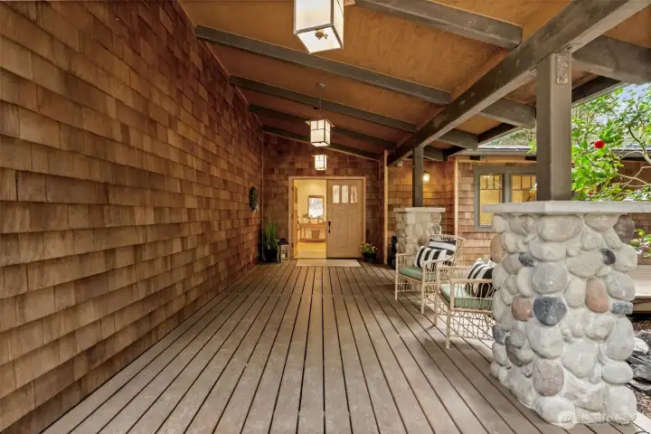 Covered entry with natural wood and stone detail
