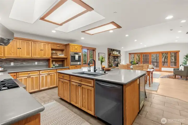 Open living space with large windows and wooded views