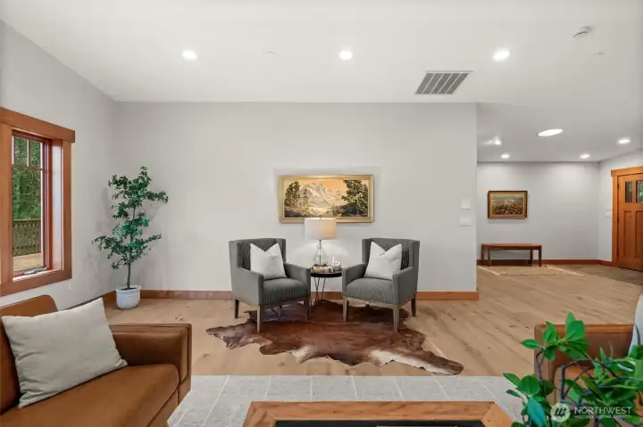 Flexible living area with space for seating, dining, or a home office