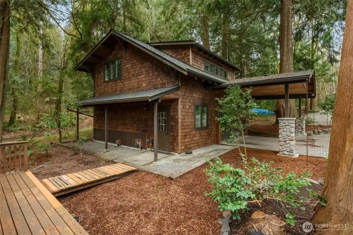 Detached garage and guest space surrounded by trees and privacy