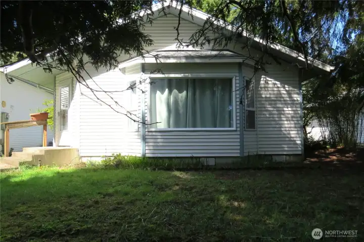 Perched on a large double lot, this home offers one-level living and Craftsman styling for timeless curb appeal!