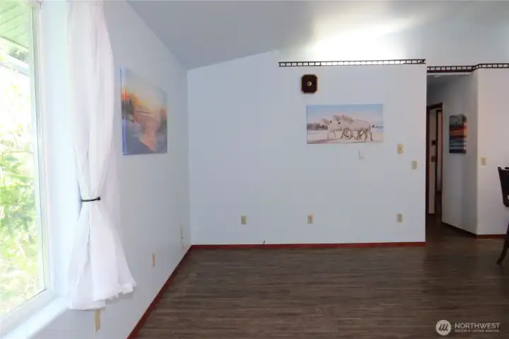 The living area is bright and sunny with large windows to bring in natural lighting!