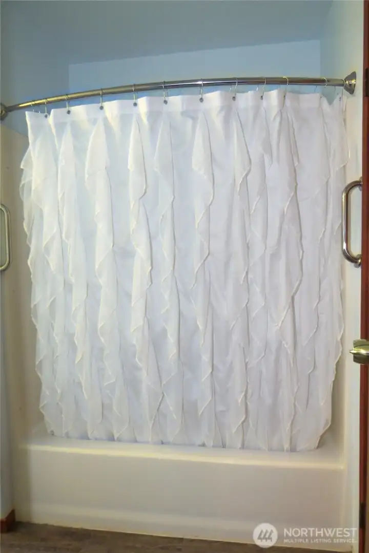 The home has a shower/tub combination with grab bars for convenience and safety!
