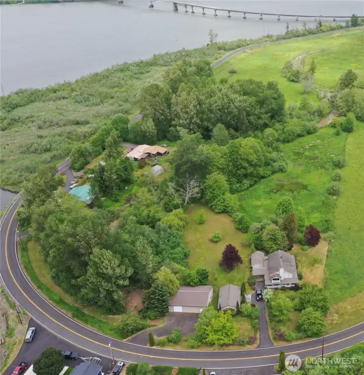 Property goes all the way around curve where green strip is mowed.