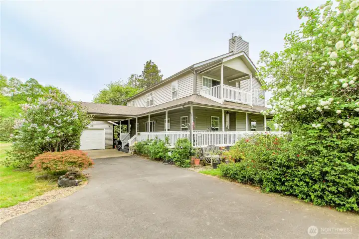 House with deck off master, drive through carport and single car attached garage.