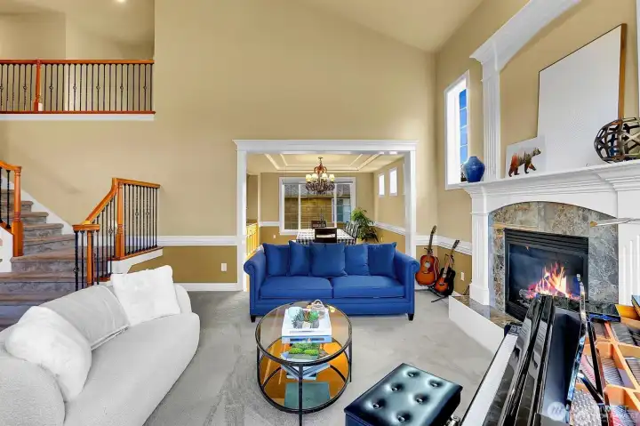 Living room with gas fireplace then leads you into the formal dining room.
