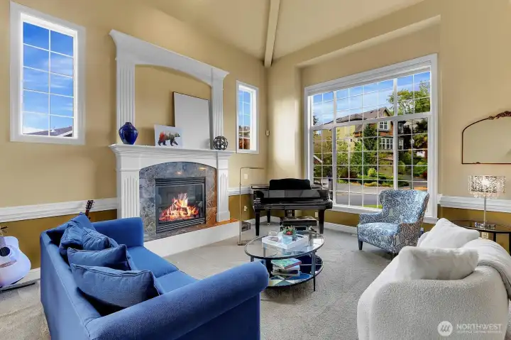 Living room with gas fireplace then leads you into the formal dining room.