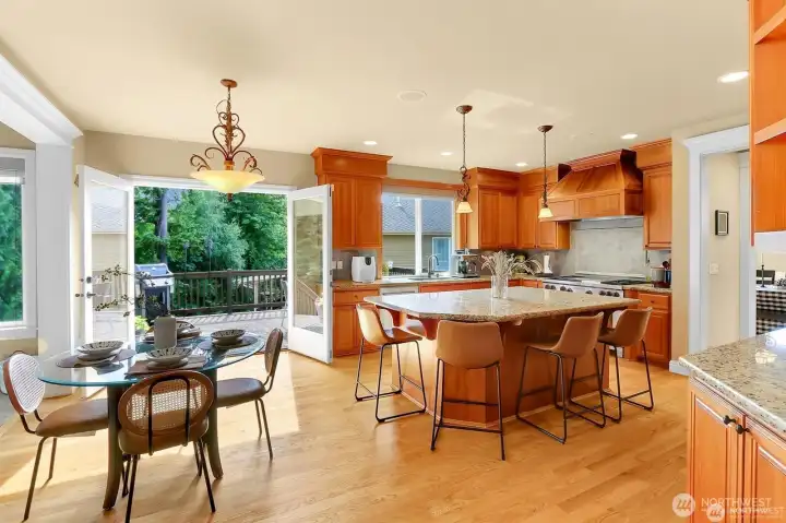 Eating bar allows for four guests, plus additional informal seating area. Double french doors lead to exterior and entertainment sized deck.