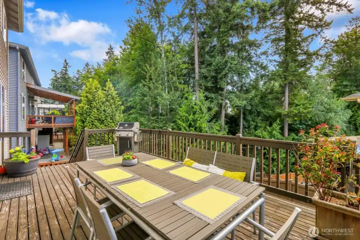 Lovely outdoor entertainment area with stair way access to back yard.