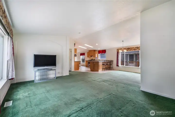 Large living room area with lots of light