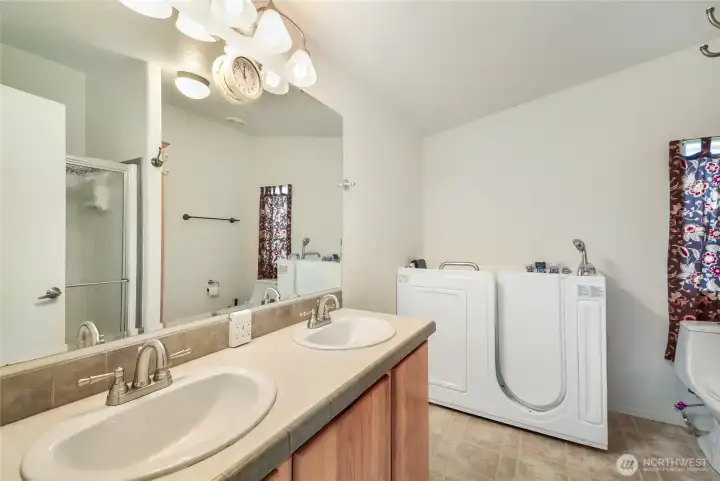 Primary includes walk in soaking tub