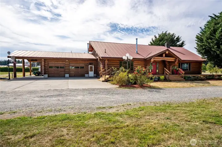 This charming log home sits on nearly 4 acres