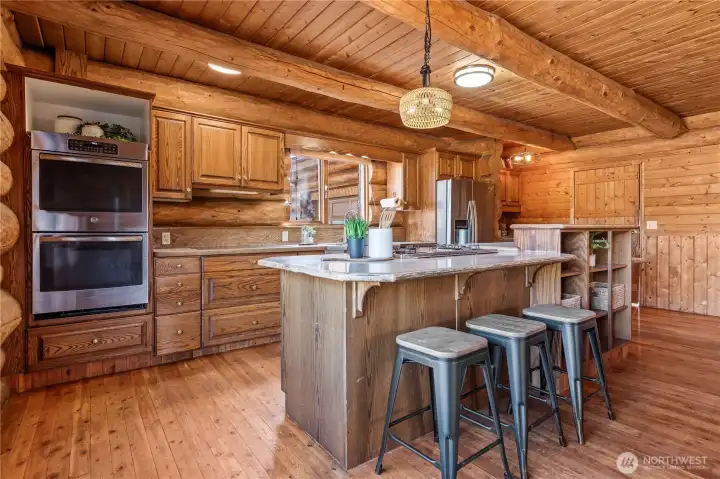 The open kitchen has bar seating and is easy to connect with everyone around as you prepare delicious meals