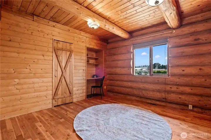 Bedroom 2 features a built in desk nook that could be used for remote work, hobbies and more