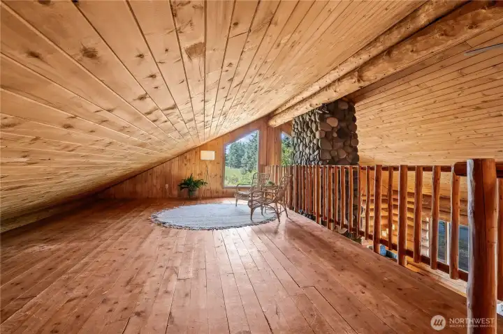 This generous loft space is a great flex area that could be used for yoga, hobbies, play or more