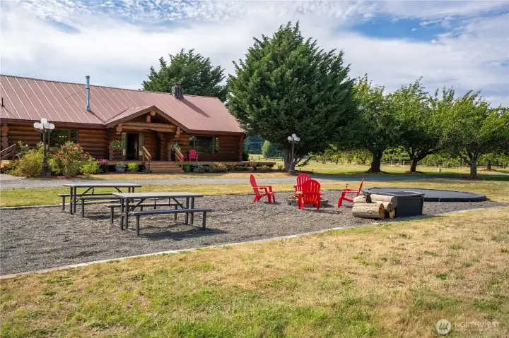 The firepit entertaining space even has room for picnic tables