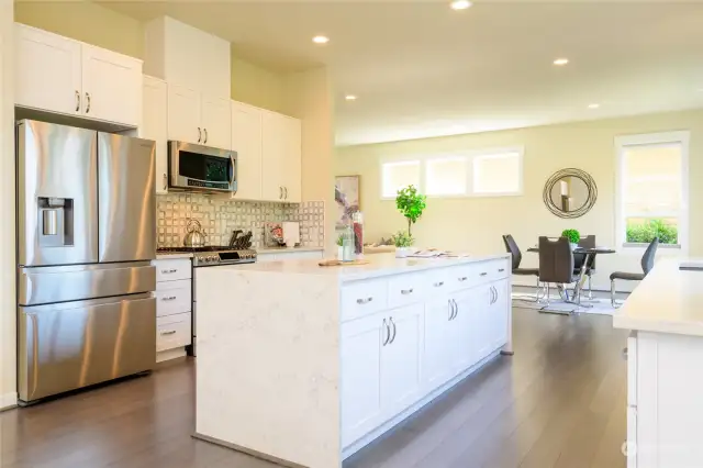 Bright and Beautiful kitchen with quartz counter tops.