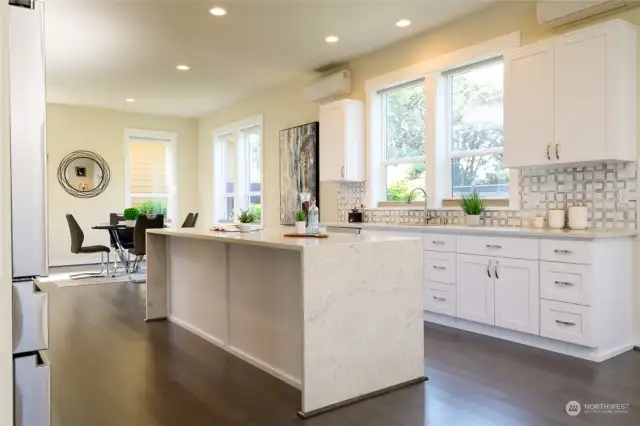 kitchen windows overlooking the private backyard and patio