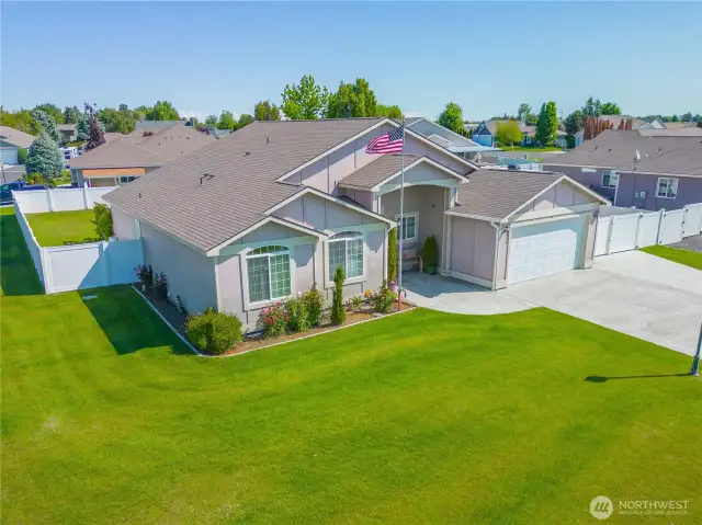 Front of the home sitting on a large corner lot