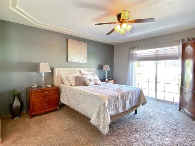 Primary bedroom with a slider to the backyard
