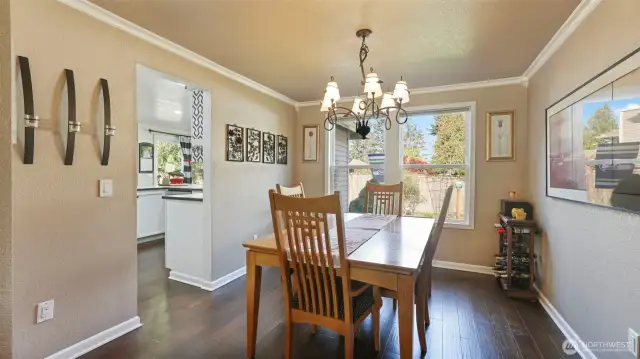 Spacious dining room with direct access to the kitchen and living room- perfect for everyday meals.