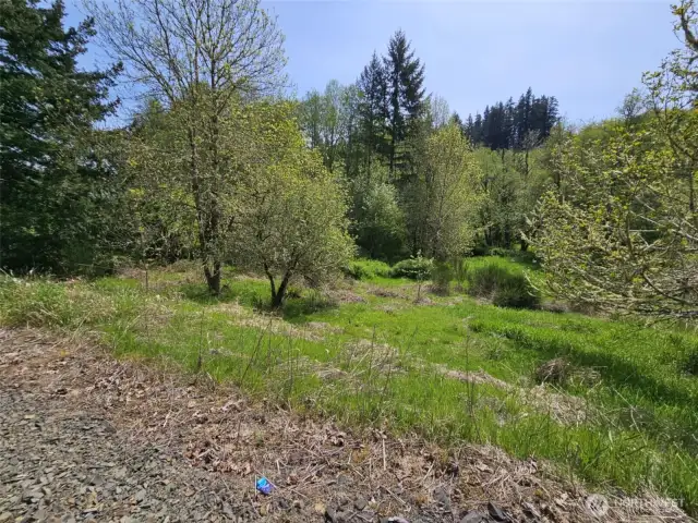 A slight drop down to mostly flat land.