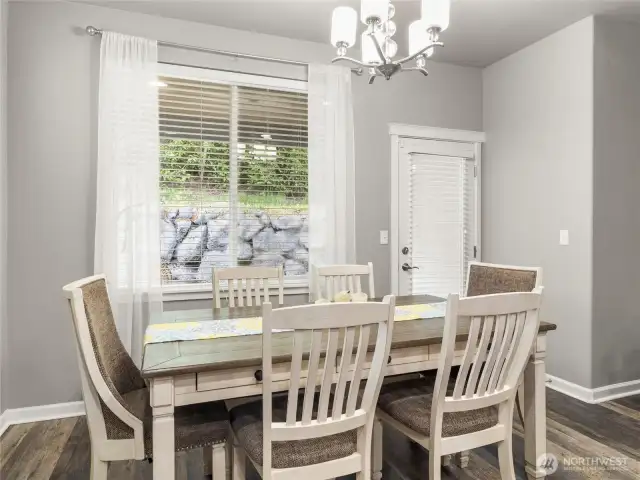 dining with door out to backyard perfect for entertainint