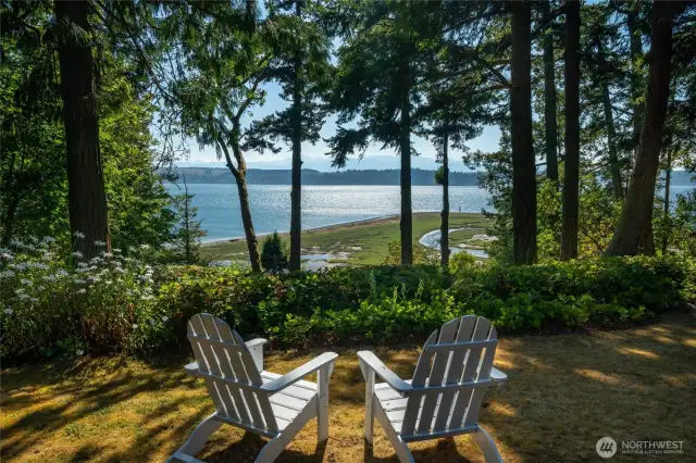 144 ft of high-bank waterfront overlooking tideland marsh on Hood Canal and views of Olympic Mtns.
