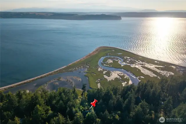 Views of Hood Canal and Olympic Mountains. The property has access to the tideland marsh beach.