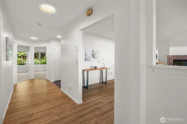 Two bedrooms, One full bath near front door and hallway that leads to living room and views.