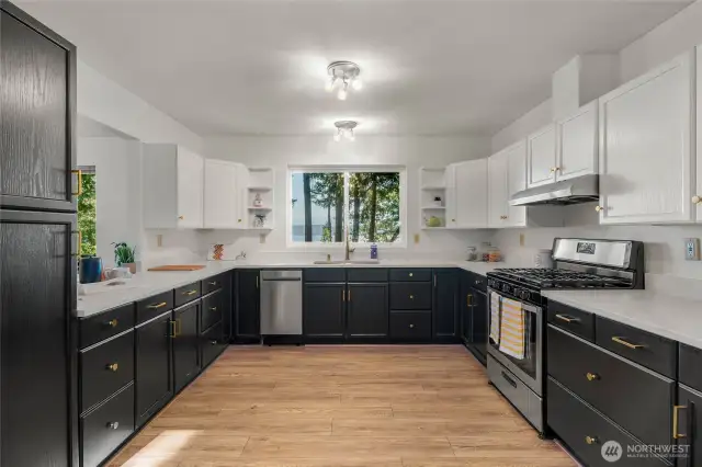 Spacious kitchen with brand new paint and updated quartz counters. Views from new oversize deep sink and faucet.