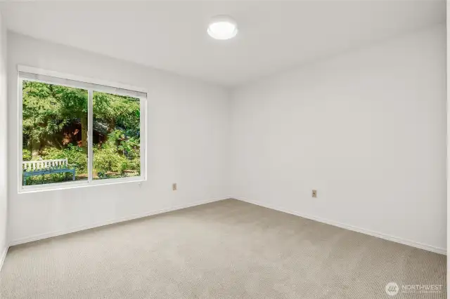 Bedroom 3 with new carpet, fresh paint and new light fixture.