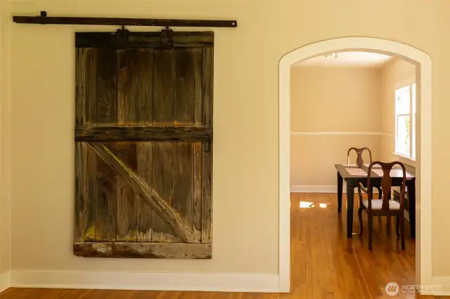 Original barn doors from the property's old barn provide authencity to the home.
