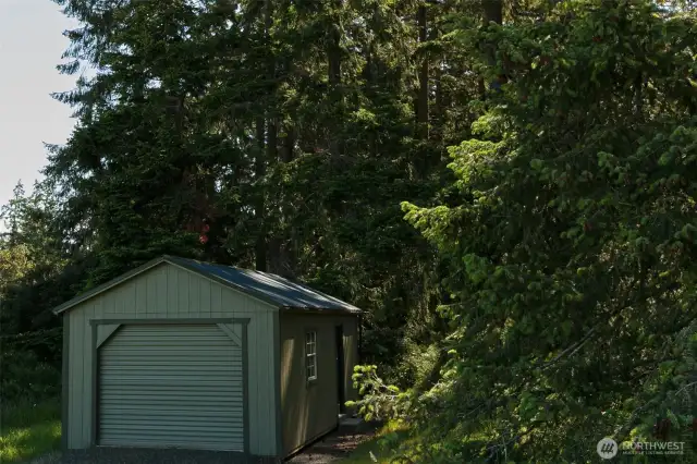 One car garage with roll up door was recently purchased and has gutters and downspouts installed.  Very lightly used.