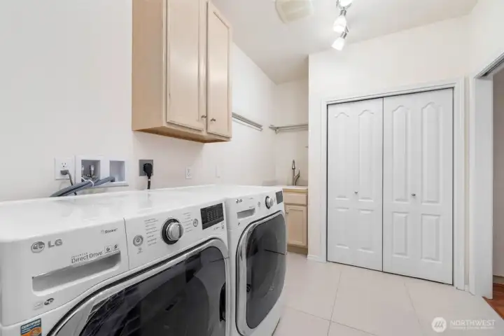 Utility room with sink and more storage...Make sure to check out the special feature in this closet!
