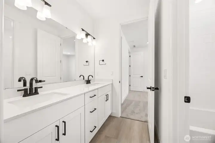 Jack and Jill Bathroom on the second floor  Photos are of another home in the community- finishes will vary.