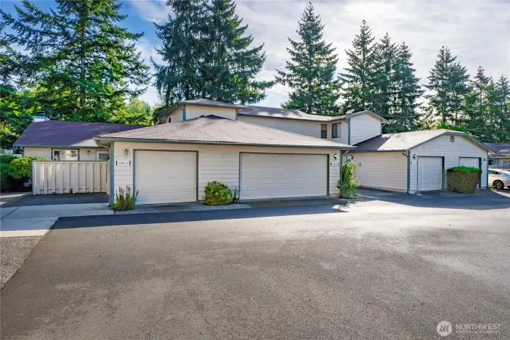 Attached 1-car garage with exterior access and extra storage space.