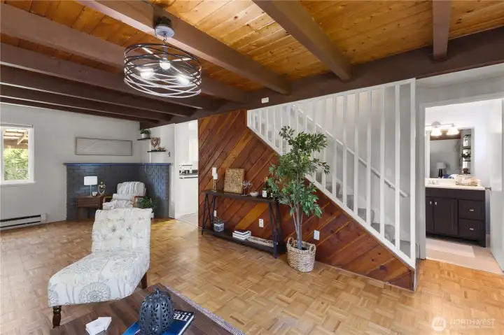 Dining area with vaulted wood ceiling and sliding doors to the covered patio.