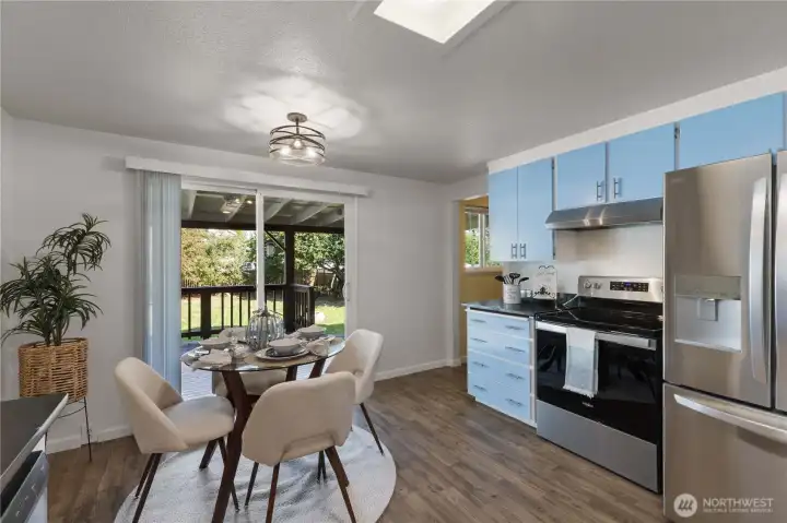 Sunlit kitchen with a fresh, modern color palette and backyard views—ideal for everyday living or entertaining.