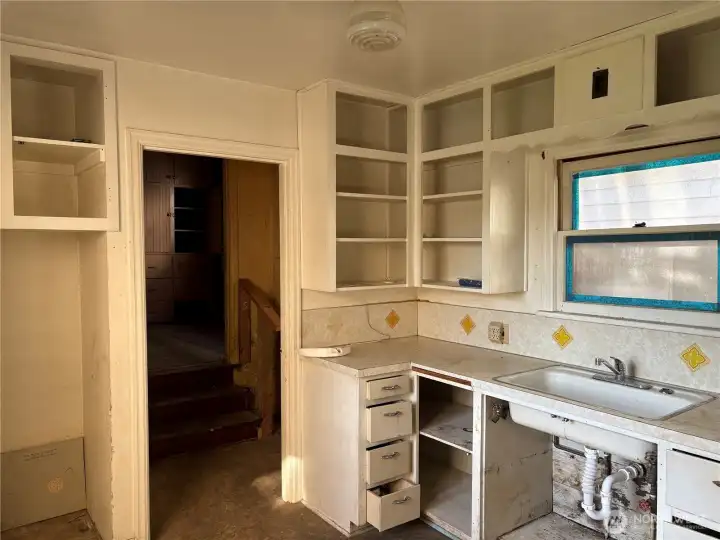 221- Kitchen opens to laundry room that connects the structures.