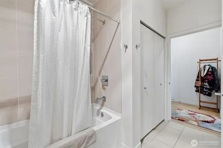 Full bath with shower and soaking tub.