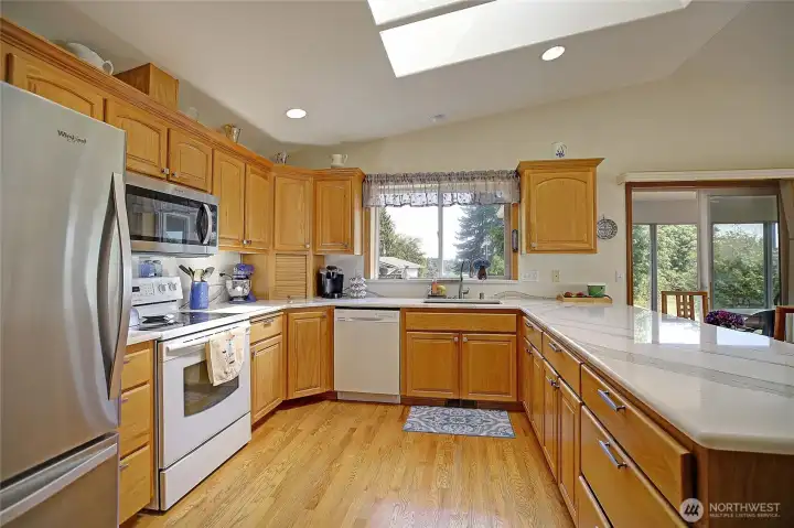 Chef's kitchen with granite countertops and tons of storage.
