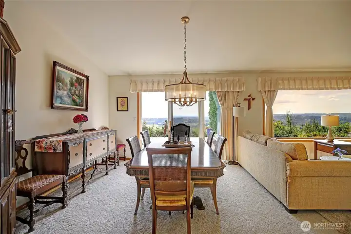Spacious dining room with access to deck and so much natural light.