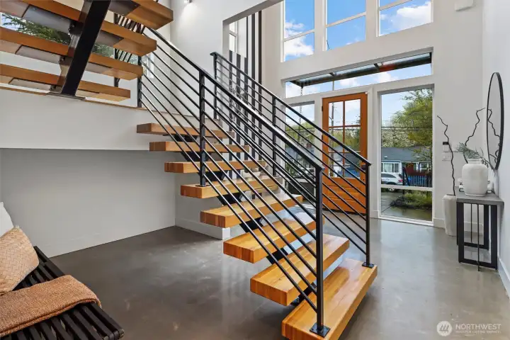 Floating staircase with expansive windows