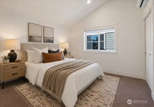 Secondary bedroom also with vaulted ceiling (virtually staged)