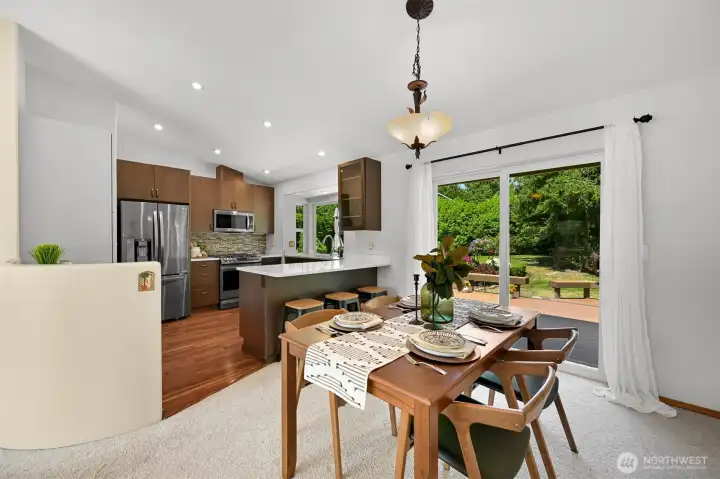 Ample space for a large dining table while still having room for a few bar stools for casual eating. Ample space for a large dining table while still having room for a few bar stools for casual eating.
