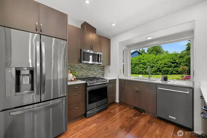 Newly renovated kitchen in 2018. Quartz countertops, Acacia wood floors, LG and Kitchen Aid appliances. Newly renovated kitchen in 2018. Quartz countertops, Acacia wood floors, LG and Kitchen Aid appliances.