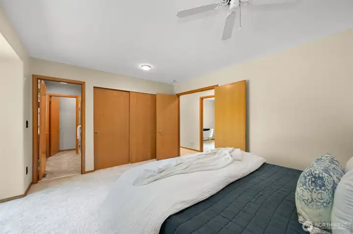 French doors lead to the hallway, and the ensuite bathroom is to the left. French doors lead to the hallway, and the ensuite bathroom is to the left.